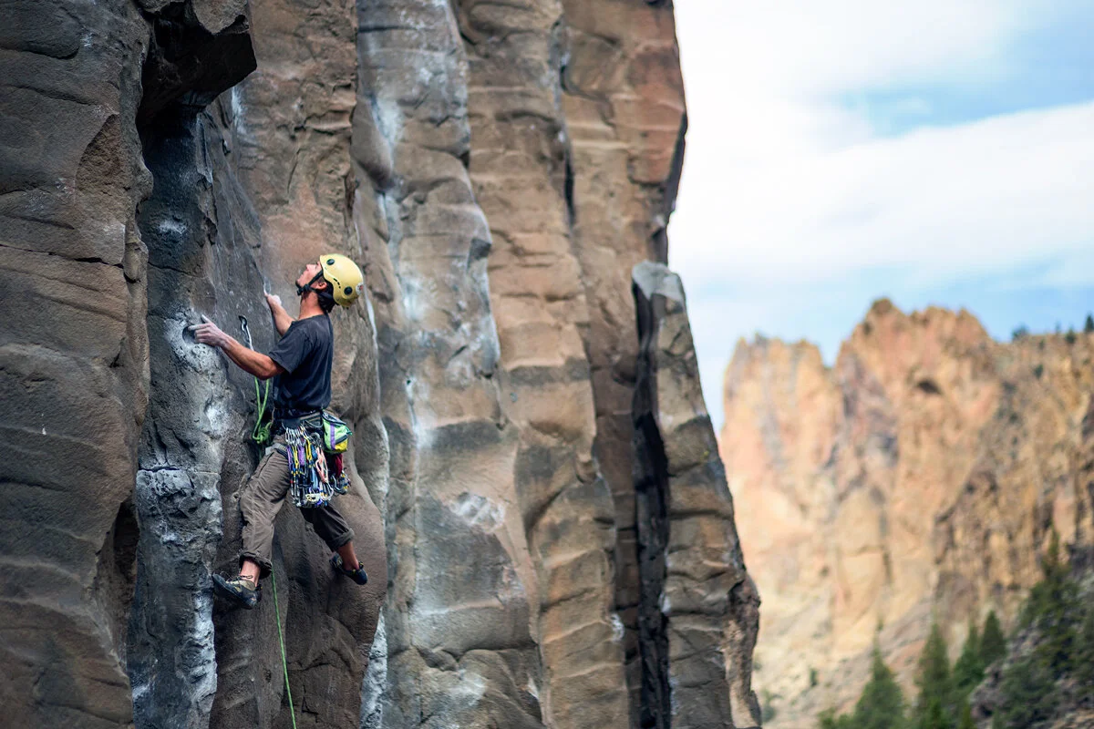 Climber scaling a rock face in the Smith Rock gorge