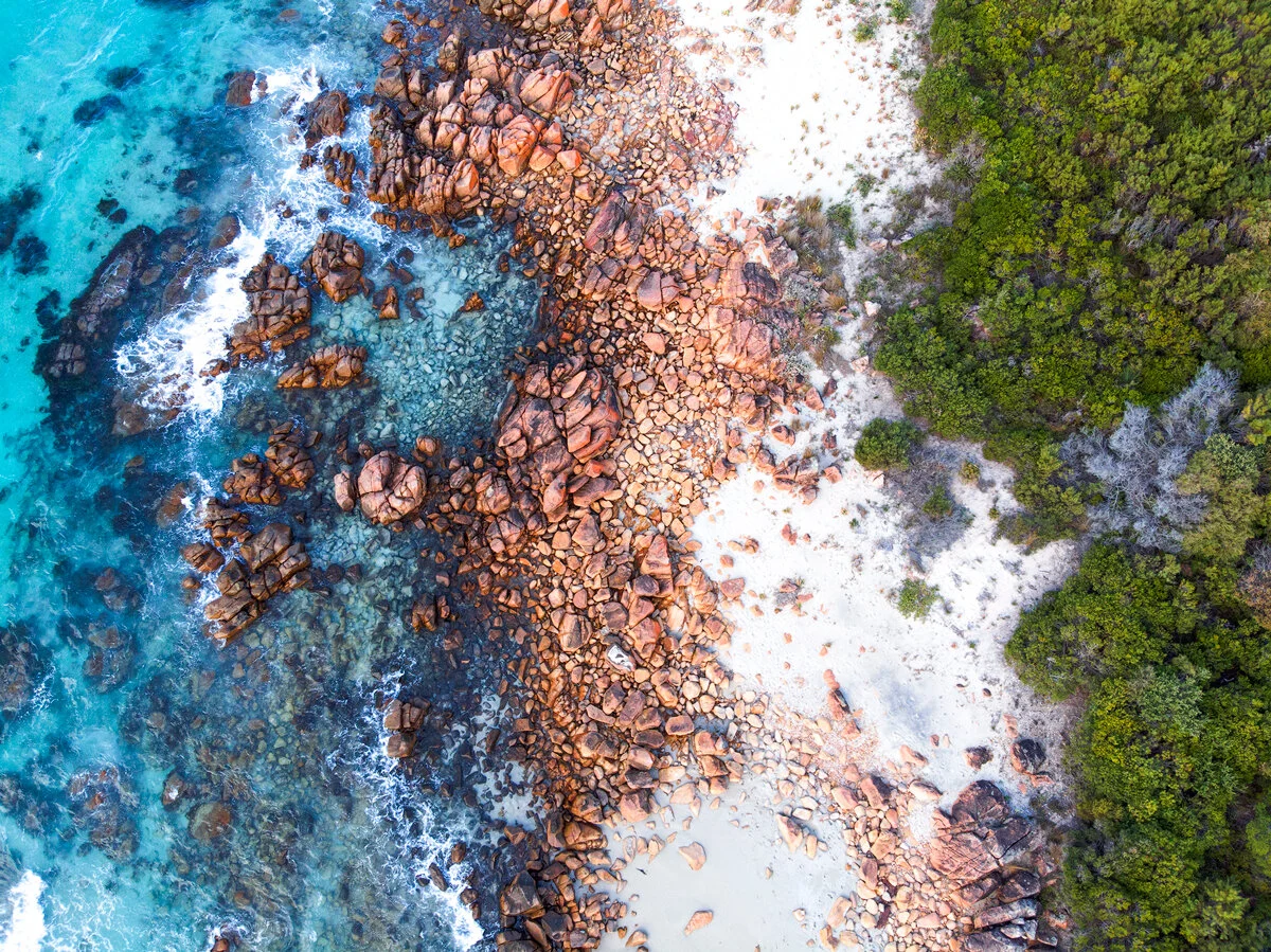 Aerial view of granite boulders along the Eagle Bay coastline in Western Australia
