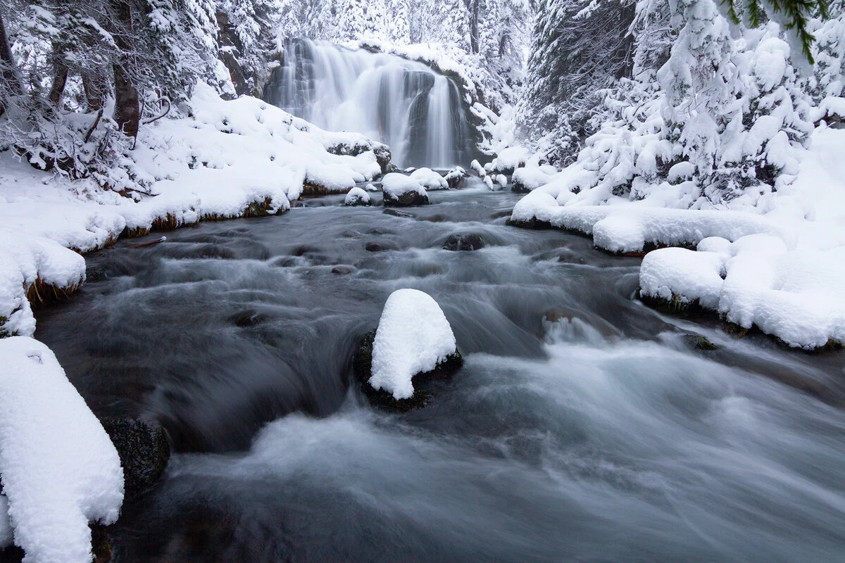 Fall Creek Falls framed by deep snowdrifts in winter