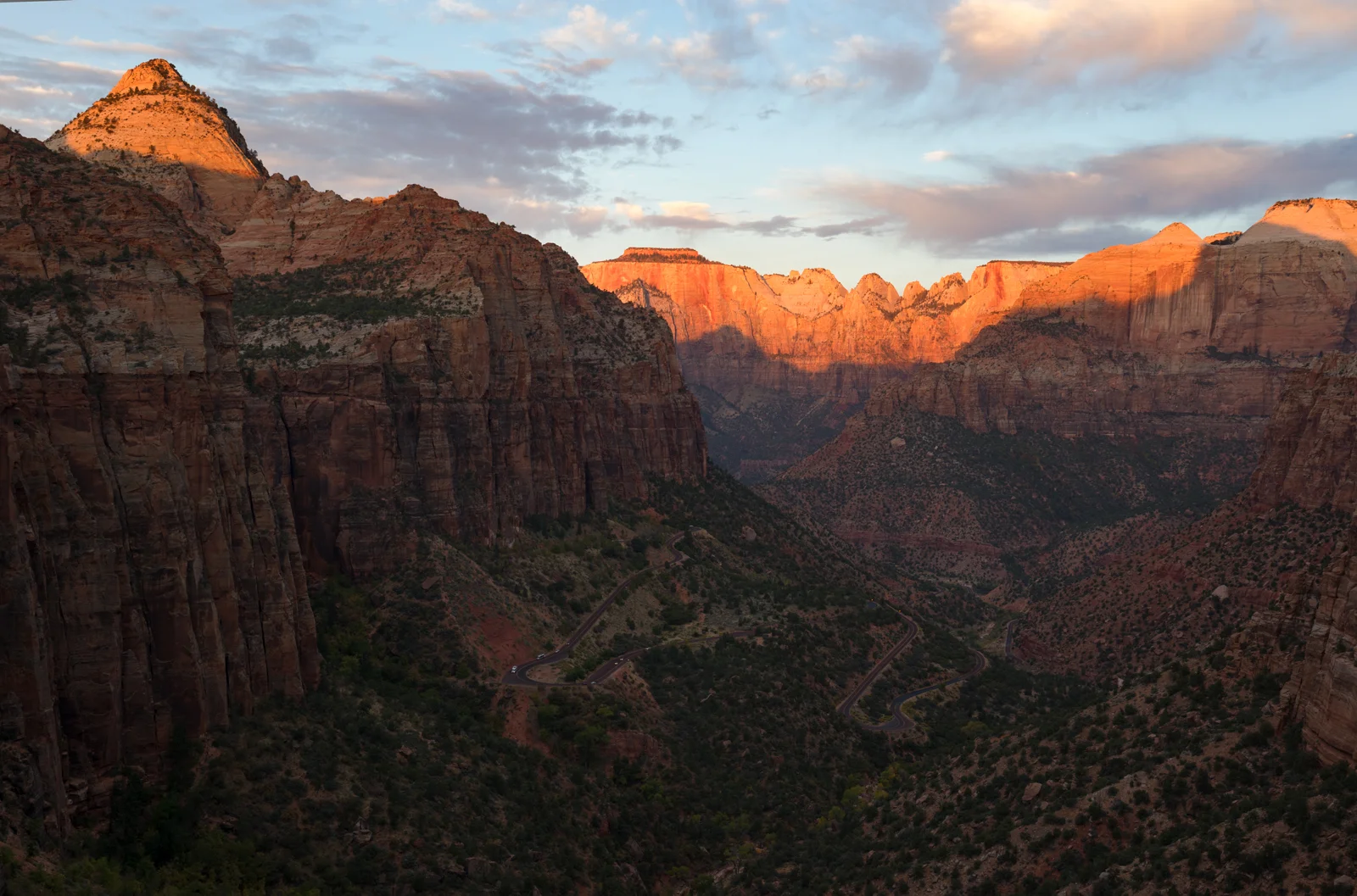Zion Canyon towers glowing orange at sunset from Canyon Overlook